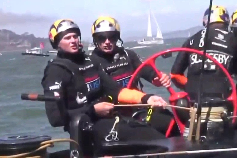 AC34 Race 14 Spithill using buttons to control board rake. Leg 3 upwind. Right hand hidden.