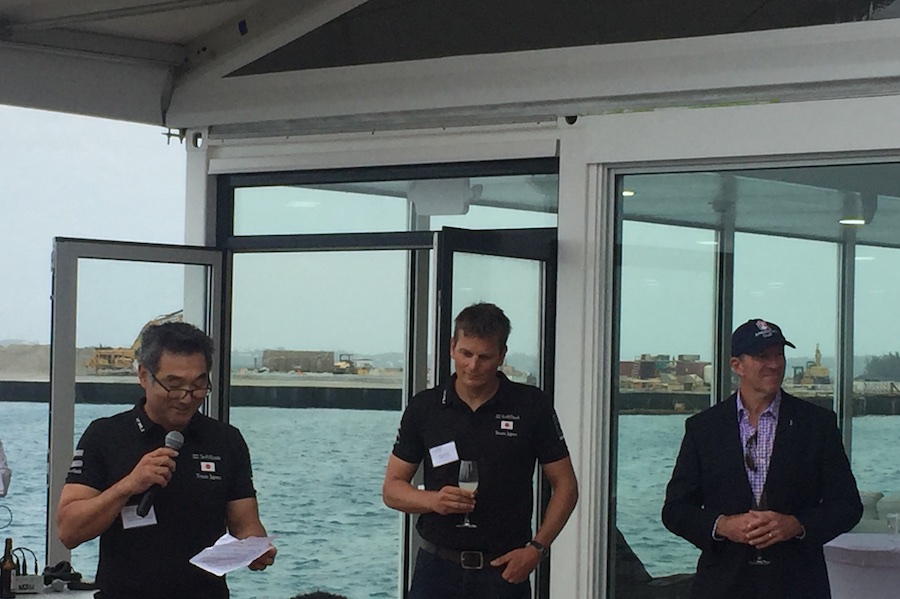 General Manager Kazuhiko "Fuku" Sofuku proposed a toast - CEO Dean Barker and Bermuda Premier Michael Dunkley stand ready with glass of sake in hand. In the background you can see the progress on infill for the site of the America's Cup Village in South Basin. 