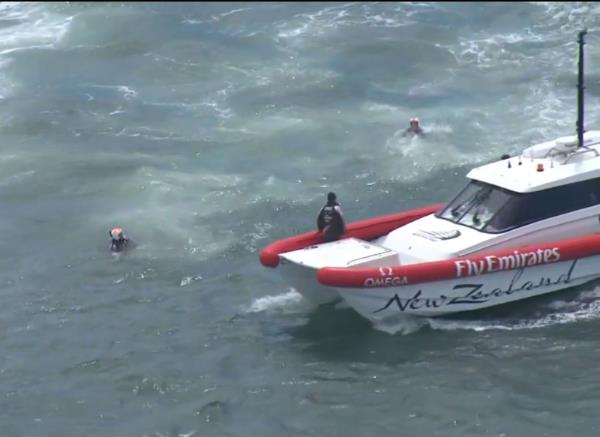 America's Cup Chris Ward and Rob Waddell being picked up by rescue boat.    Image: ACTV